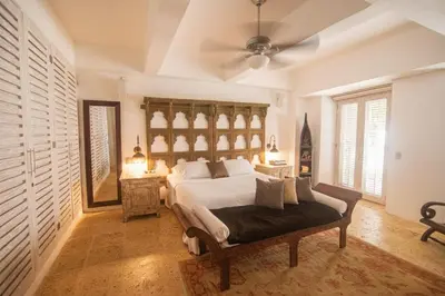 a bedroom with a bed and a ceiling fan at Casa Del Hobo in Cartagena de Indias