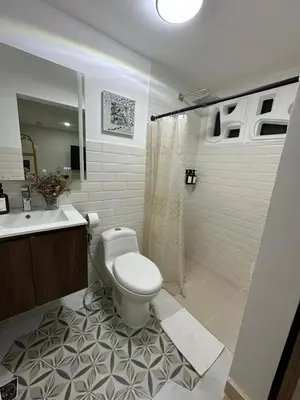 a bathroom with a toilet and a sink and a shower at House 4-71 in Cartagena de Indias