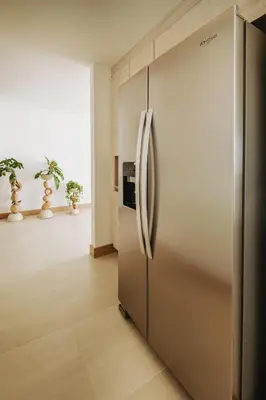 a large stainless steel refrigerator in a room at Morros EOS Manzanillo del mar in Cartagena de Indias