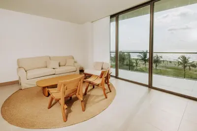 a living room with a couch and a table and chairs at Morros EOS Manzanillo del mar in Cartagena de Indias