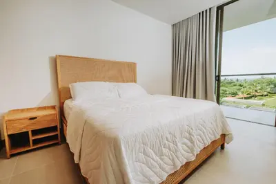 a bedroom with a large bed and a large window at Morros EOS Manzanillo del mar in Cartagena de Indias