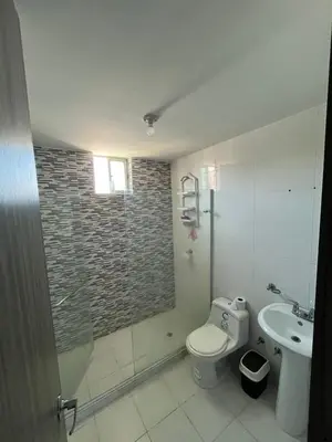 a bathroom with a shower and a toilet and a sink at Sebastián torres in Barranquilla