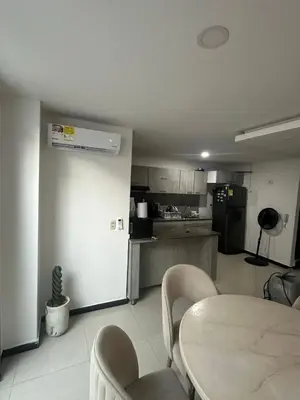 a kitchen with a table and chairs in a room at Sebastián torres in Barranquilla