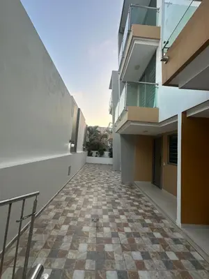 an empty hallway of a building with a checkered floor at Sebastián torres in Barranquilla