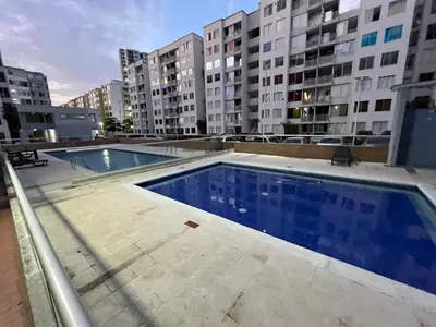a swimming pool in a building with tall buildings at El encanto de Cartagena in Cartagena de Indias
