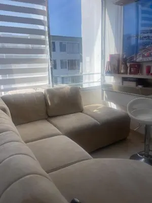a couch in a living room with a large window at El encanto de Cartagena in Cartagena de Indias