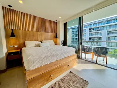 a bedroom with a large bed and a balcony at Morros Zoe - Ocean View Paradise, Serena Del Mar, Cartagena in Cartagena de Indias