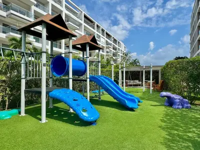 a playground with blue slides in front of a building at Morros Zoe - Ocean View Paradise, Serena Del Mar, Cartagena in Cartagena de Indias