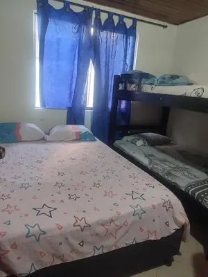 a bedroom with a bed with stars on it at Sun Beach 41 in Cartagena de Indias