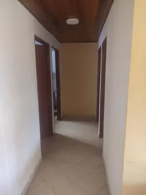 an empty hallway with doors and a tile floor at Sun Beach 41 in Cartagena de Indias