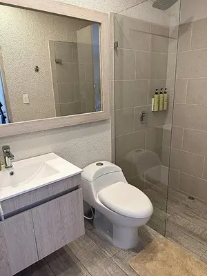 a bathroom with a toilet and a sink and a shower at Tu refugio en la playa, moderno cómodo con estilo in Cartagena de Indias
