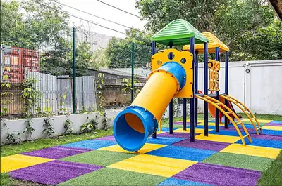 a playground with a slide on a colorful rug at Tu refugio en la playa, moderno cómodo con estilo in Cartagena de Indias