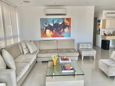 a living room with a couch and a table at Apartamento en Riomar a pocas cuadras CC Buenavista in Barranquilla