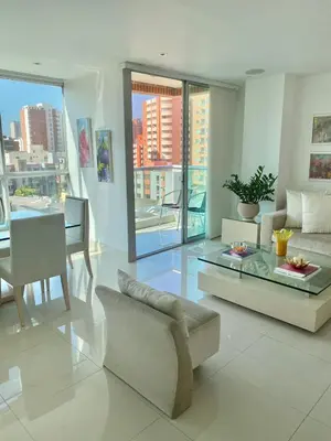 a living room with a couch and a table at Apartamento en Riomar a pocas cuadras CC Buenavista in Barranquilla