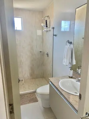 a bathroom with a shower and a toilet and a sink at Apartamento en Riomar a pocas cuadras CC Buenavista in Barranquilla