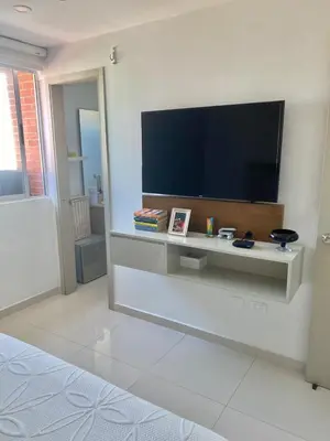 a living room with a flat screen tv on a wall at Apartamento en Riomar a pocas cuadras CC Buenavista in Barranquilla