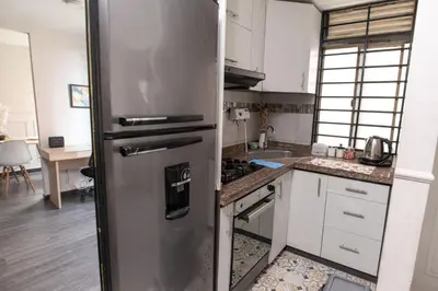 a kitchen with a stainless steel refrigerator at Comodo apartamento en el norte de Barranquilla in Barranquilla