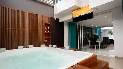 a large bath tub in a room with a tv at MQ CROWN HOUSE CASTIllO in Cartagena de Indias