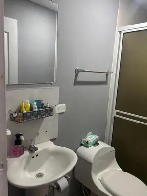 a bathroom with a sink and a toilet and a mirror at Gisela Wax More Hostel in Cartagena de Indias