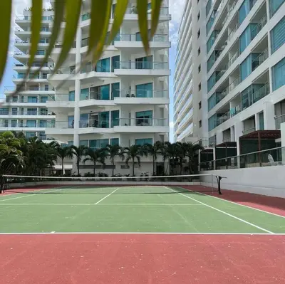 a tennis court in front of a large building at Morros Seaway 935 Apto 806 in Cartagena de Indias