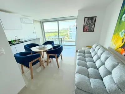a living room with a couch and a table and chairs at Morros Seaway 935 Apto 806 in Cartagena de Indias