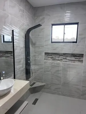 a bathroom with a sink and a shower at Villa Sabanilla Casa bifamiliar campestre con piscina privada Aire acondicionado Tranquilidad total in Puerto Colombia