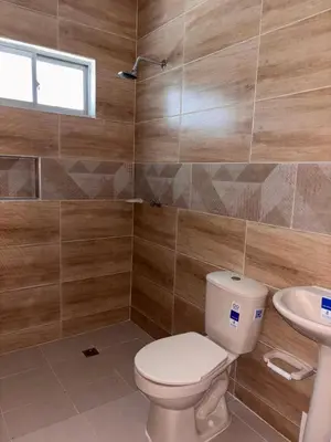 a bathroom with a toilet and a sink at Apartamento familiar en coveñas cerca del mar in Coveñas