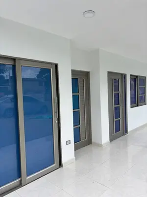 a row of glass doors in a building at Apartamento familiar en coveñas cerca del mar in Coveñas