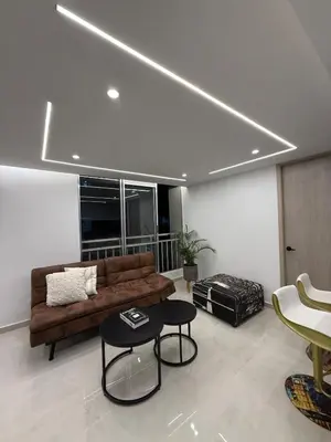 a living room with a couch and a table at Apartamento exclusivo y nuevo en el norte de Barranquilla in Barranquilla
