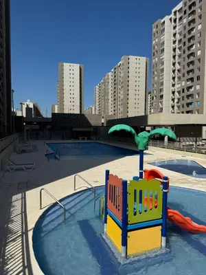 a playground in a pool with buildings in the background at Apartamento exclusivo y nuevo en el norte de Barranquilla in Barranquilla