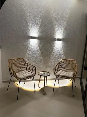 two chairs and a table in a room with lights at NEW Unique 270º view above the city walls in Cartagena de Indias
