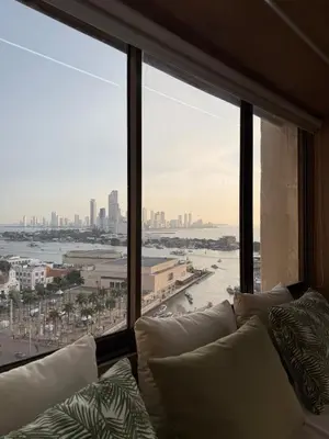 a room with a large window with a view of a city at NEW Unique 270º view above the city walls in Cartagena de Indias