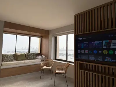 a living room with a couch and a large window at NEW Unique 270º view above the city walls in Cartagena de Indias