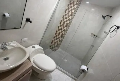 a bathroom with a shower and a toilet and a sink at Hotel Getsemaní Central in Cartagena de Indias