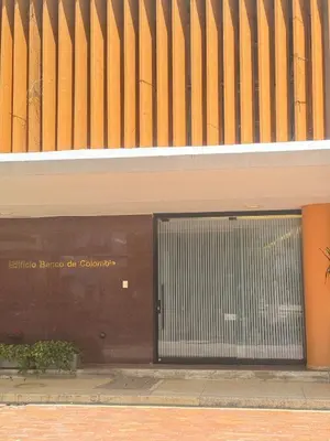 a building with a large door in front of it at Comfortable in the heart of the city! in Estación El Salto