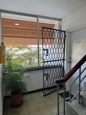 a glass door in a room with a window at Comfortable in the heart of the city! in Estación El Salto