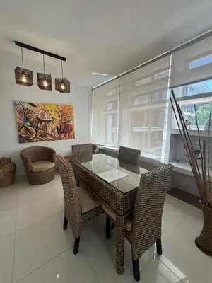 a dining room with a glass table and chairs at Comfortable in the heart of the city! in Estación El Salto