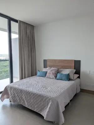 a bedroom with a large bed with a large window at Manzanillo Morros Kai 526 in Cartagena de Indias
