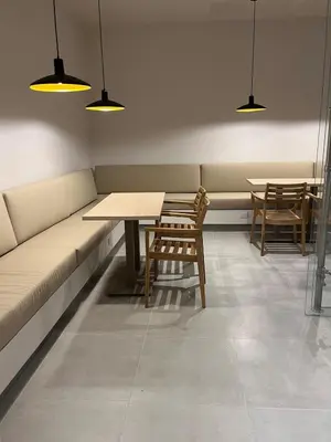 a room with a couch and tables and lights at Terraza del Mar in Santa Marta