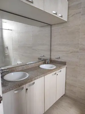 a bathroom with two sinks and a mirror at Apto Coveñas in Coveñas