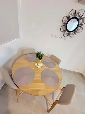 a dining room table with chairs and a mirror at Apartamento Hermoso en Manzanillo del Mar Cartagena in Cartagena de Indias