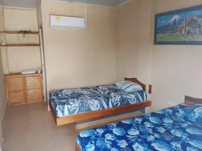 a bedroom with two beds and a bunk bed at Hotel Pesquera rincon berrugas in Berrugas