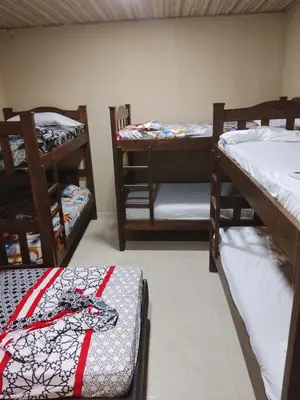 a room with three bunk beds in a room at Hotel Pesquera rincon berrugas in Berrugas