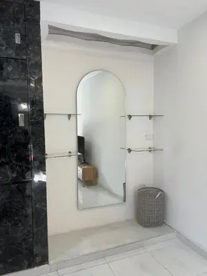 a mirror on a wall in a room at Rojas House in Barranquilla