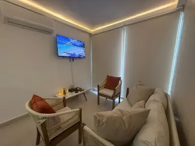 a living room with a couch and a table at Apartamento con cercania al Mar y centro historico in Cartagena de Indias