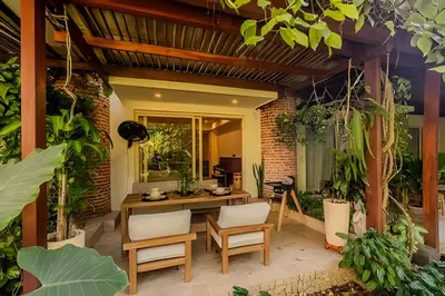 a patio with a table and chairs and plants at Colonial Elegance in Historic Center /Pool in Cartagena de Indias