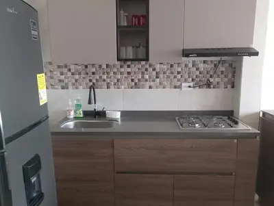 a kitchen with a sink and a stove top oven at 3 Bedroom Apartment in Cartagena 5 Min to The Beach and The Walled City in Cartagena de Indias