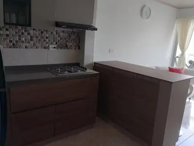 a kitchen with a stove and a counter top at 3 Bedroom Apartment in Cartagena 5 Min to The Beach and The Walled City in Cartagena de Indias