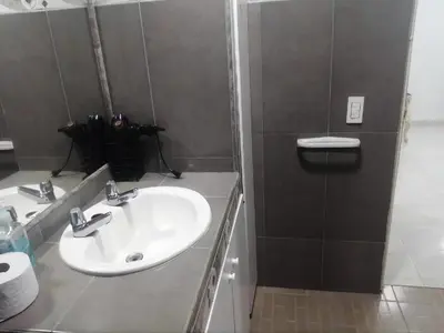 a bathroom with a white sink and a mirror at Cartagena Sotavento Laguito in Cartagena de Indias