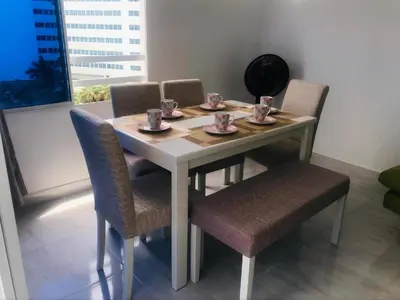 a white table with chairs and cups on it at Cartagena Sotavento Laguito in Cartagena de Indias